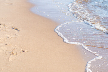 Soft wave of the sea on the sandy beach.Soft focus,blurred image.