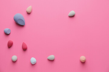 Makeup sponges on color background