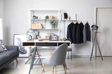 Modern workplace and book shelf with decor in interior of room