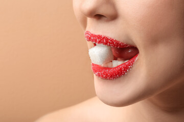 Beautiful young woman with sugar lips, closeup