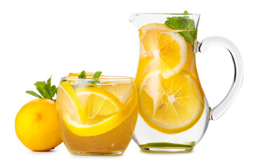 Jug and glass of tasty cold lemonade on white background