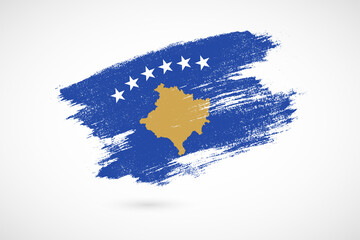 Fototapeta premium Happy independence day of Kosovo with vintage style brush flag background