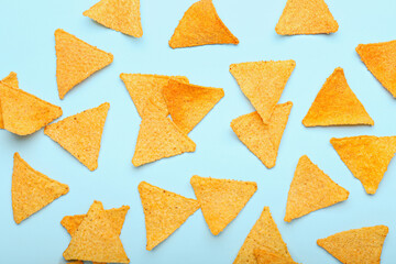 Tasty nachos on color background