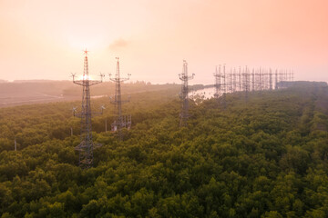 Obraz premium Aerial drone top view of Wind turbines station offshore at sunrise, Clean energy renewable energy and environment, Eco technology for electric power.
