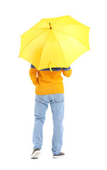 Handsome young man with umbrella on white background, back view