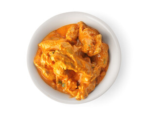 Bowl of tasty chicken tikka masala on white background