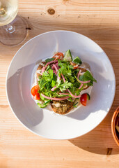 Fresh falafel salad on a table at an outdoor cafe bright cheerful image from above