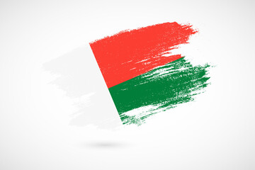 Happy independence day of Madagascar with vintage style brush flag background