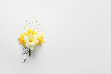 Creative composition with beautiful daffodils and drawn boy on light background