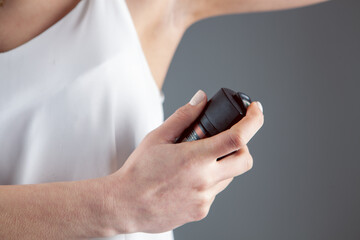 young girl with aerosol deodorant