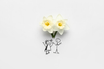 Beautiful daffodils and drawn couple on light background