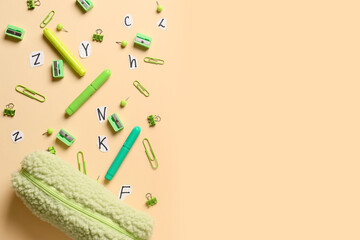 Pencil case and stationery on color background