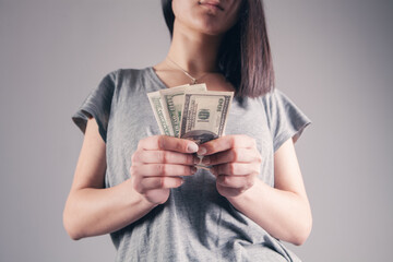 girl holding  money in her hands