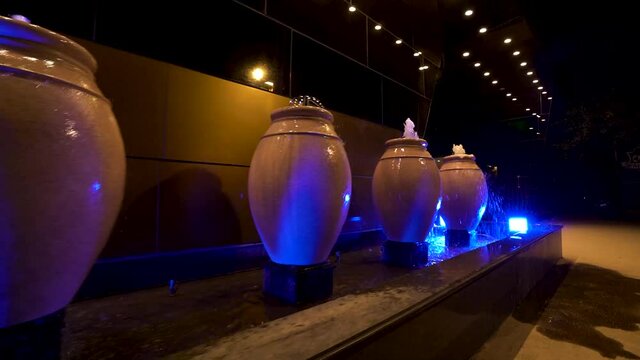 Water fountains at night. White Designer water fountains. 