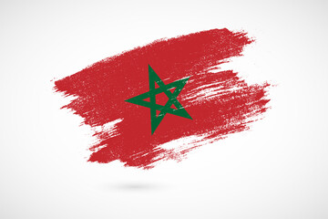 Happy independence day of Morocco with vintage style brush flag background
