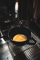 Cup of cappuccino on a wooden table, close up 