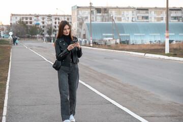 person walking on the street with phone