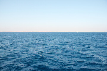 The front view in the morning sky is bright blue with clear white clouds. And the ocean deep indigo...