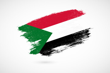 Happy independence day of Sudan with vintage style brush flag background