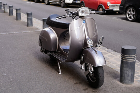 Vespa Vintage scooter grey in sixties concept parked in street