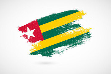 Happy independence day of Togo with vintage style brush flag background