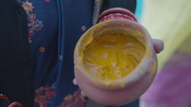 Turmeric paste for Indian traditional rituals. Haldi used at Indian wedding ceremony. 