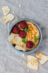 Chickpea hummus, beetroot falafel with paprika, olive oil, pita bread