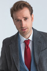 portrait of an attractive fashion model wearing suit with tie
