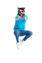 cool unshaved hipster man in hoodie pointing fingers and jumping