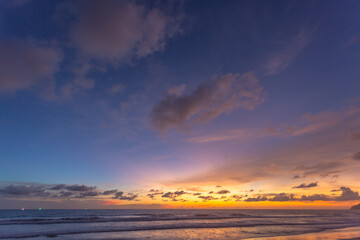 Fototapeta premium Majestic sunset or sunrise landscape Amazing light of nature cloudscape sky and Clouds moving away rolling .Beautiful Phuket beach is a famous tourist destination in Andaman sea summer. 