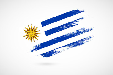 Obraz premium Happy independence day of Uruguay with vintage style brush flag background
