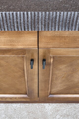 Kitchen furniture set made of toned veneer and solid ash timber with brown acrylic solid surface...
