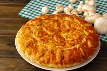 Fresh meat pie on served on wooden table