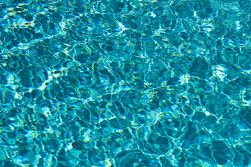 Tansparent clear calm water surface texture. Abstract nature background. Sea water pattern.