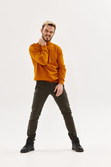 Fototapeta premium man in brown sweater fashion posing autumn style light background