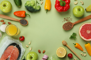 Healthy lifestyle accessories on green background, space for text