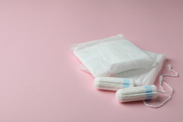 Sanitary pads and tampons on pink background © Atlas