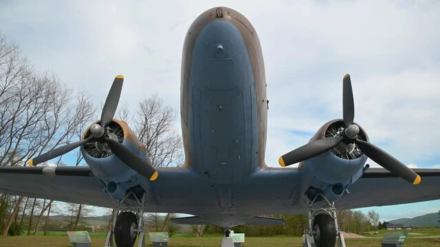 Decommissioned aeroplane, a memorial to partizans and their help to Allied air forces during WWII. Aircraft exhibit in Slovenia. Wide angle, tilt down