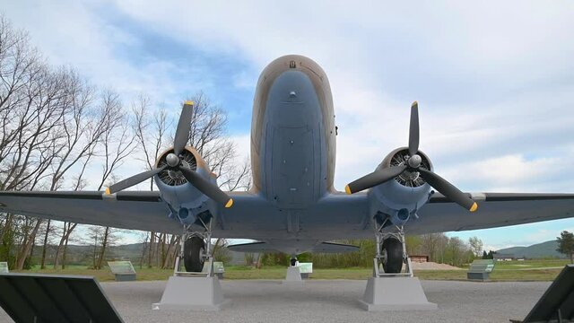 Decommissioned aeroplane, a memorial to partizans and their help to Allied air forces during WWII. Aircraft exhibit in Slovenia. Wide angle, tilt up
