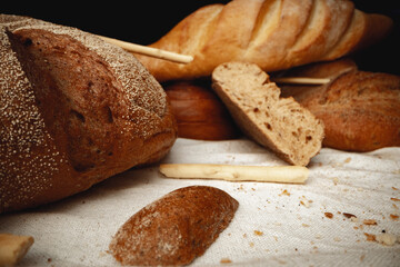 Variety of bread on tablecloth close up