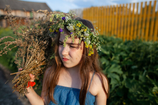 Close-up Of Girl Holding Flowering Plant