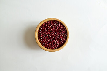 Top Views of Dried Red beans in a wooden bowl isolated on the white background, Full depth of field.