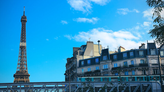 Beautiful view of  Eiffel tower with  the subway train and blue sky background