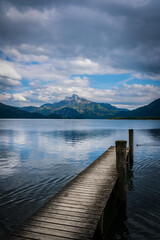 Mondsee Berge Steg Wasser Wellen Wolken Himmel Spiegelung 