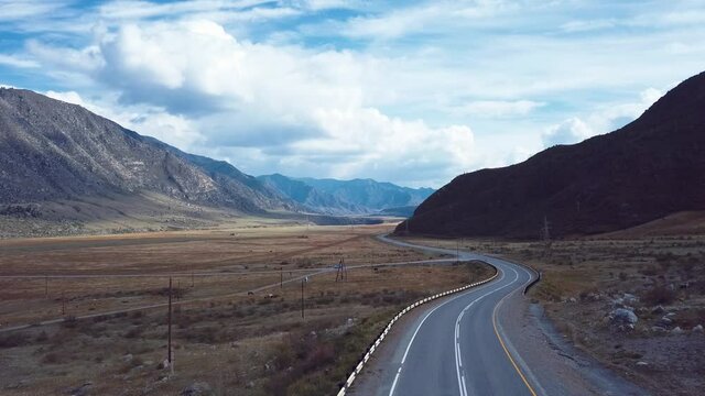 4K Aerial Footage Video of the Autumn Road and Mountain Forest on the Chemal Tract in the Altai Mountains, Russia