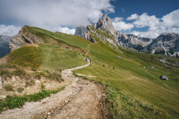 Obraz premium Hiking path and epic landscape of Seceda peak in Dolomites Alps, Odle mountain range, South Tyrol, Italy, Europe.