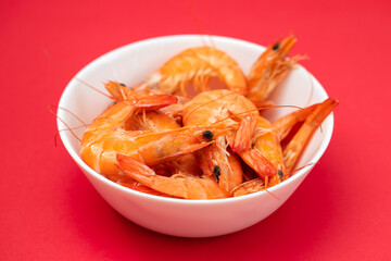 boiled gresh tasty shrimps in small white bowl