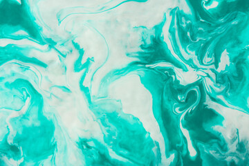 Turquoise marble texture. Abstract painting modern background. A mix of blue green and white shades, a work of art with acrylic paints. Smooth dynamic lines, fashionable design of postcards, posters