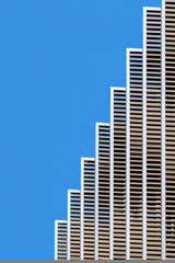 Fototapeta premium Geometric architecture detail against blue sky