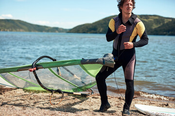 Windsurfer surfing on a windy summertime day at the river.